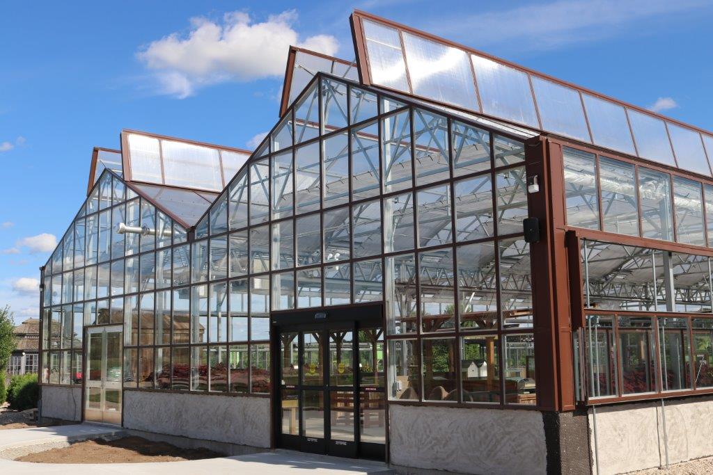 A shot of an open roof greenhouse by prospiant from the outside